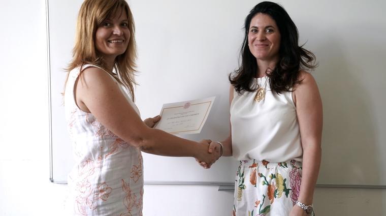 Alice Němcová Tejkalová (the Dean) is awarding Denisa Hejlová, Faculty of Social Sciences