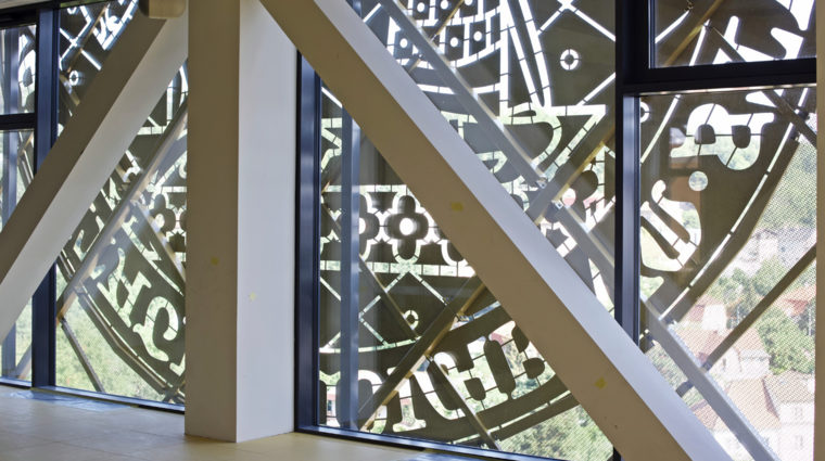 Charles University logo on glass wall