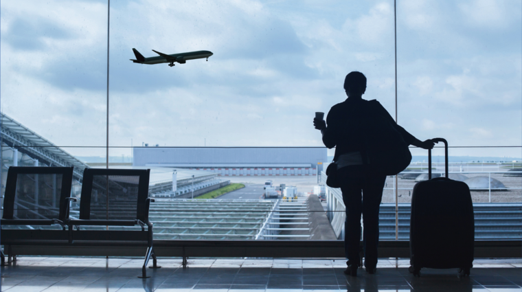 a person with a suitcase at an airport